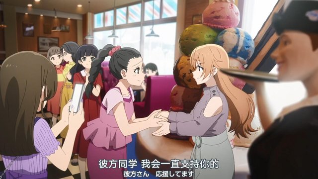 In front of a blue ice cream shop